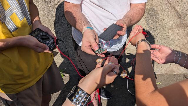Field testing solar panels and piezo sensors to measure harvested voltage in real time