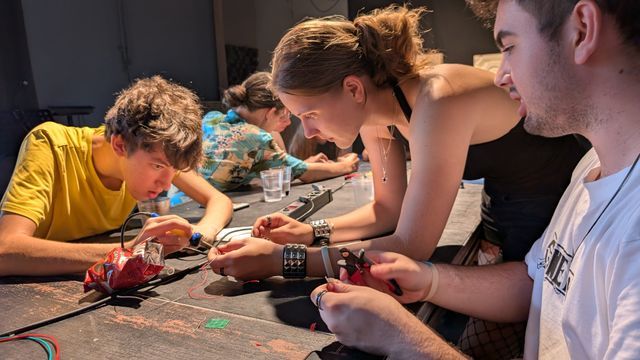 Precision teamwork while soldering the components together